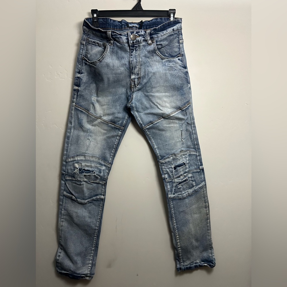 Distressed Blue Jeans with Zipper Accents - Trendy & Bold